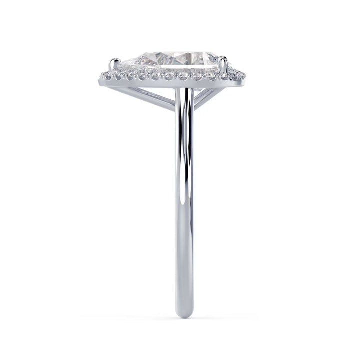 Sparkle view of a pear cut lab grown diamond halo solitaire engagement ring reflecting exceptional light performance