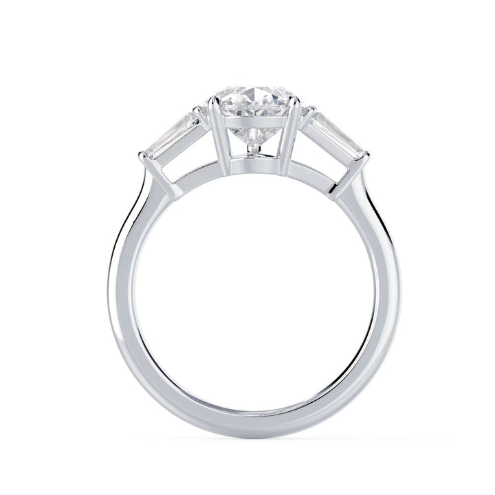 Detailed view of a pear lab grown diamond three stone solitaire engagement ring highlighting the center stone