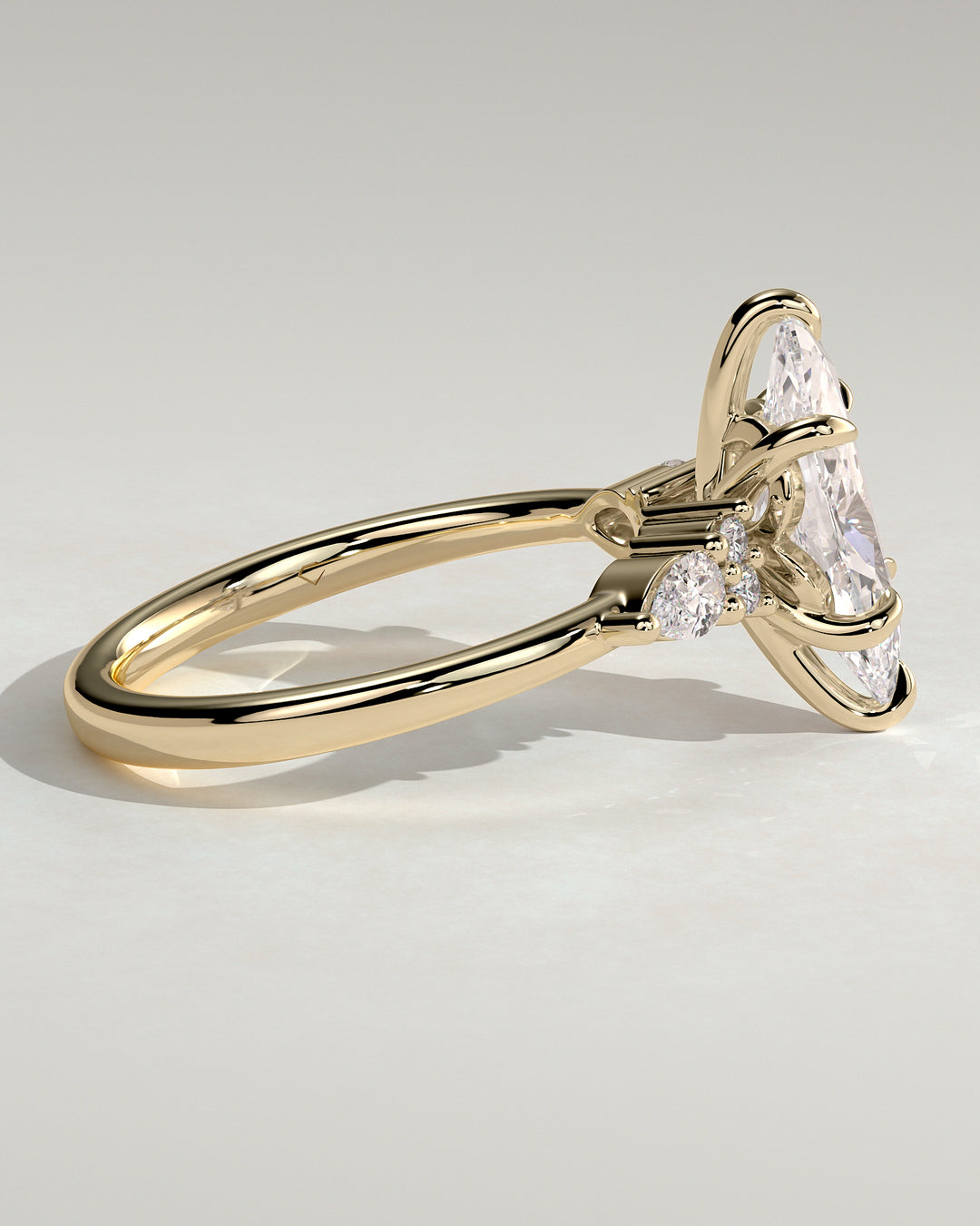 Pear & Round Side Stone Ring