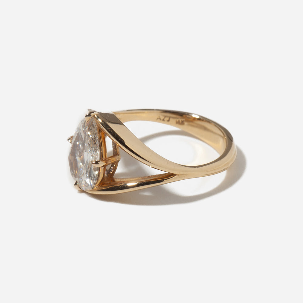 Side profile of a 2 carat pear lab grown diamond split shank engagement ring showing elegant raised antique structure