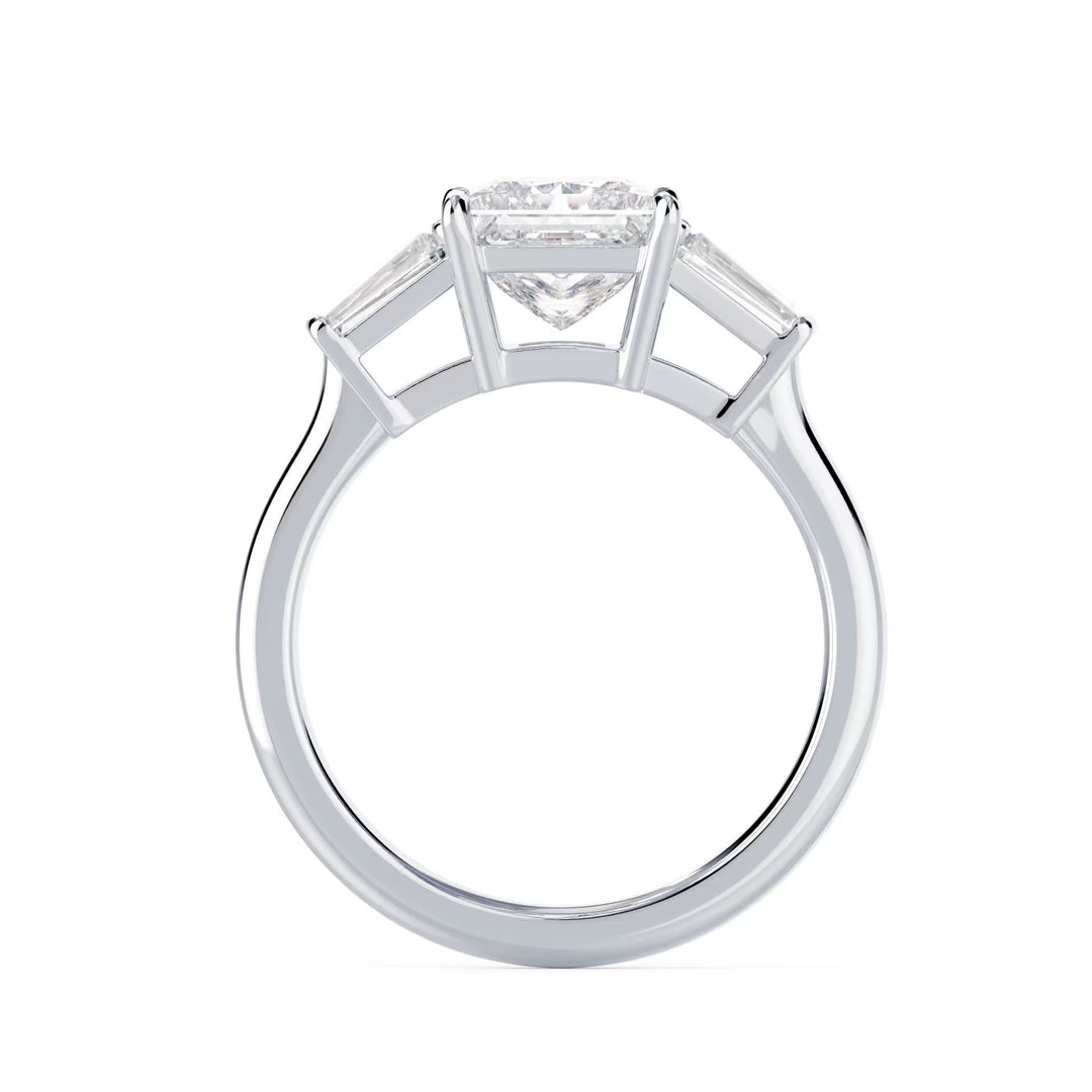 Close-up sparkle of princess cut lab grown diamond three stone engagement ring with E VS2 clarity and sharp brilliance
