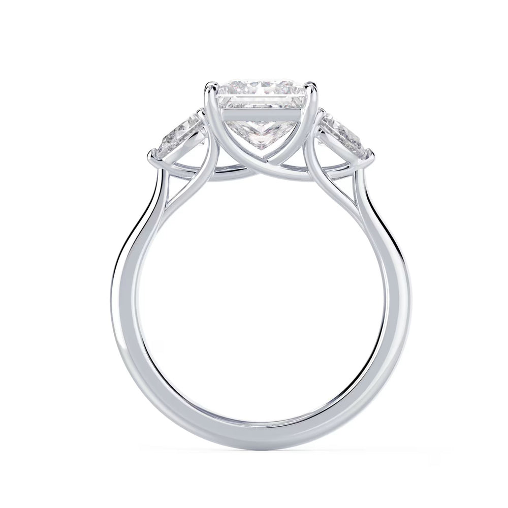 Side profile of princess cut lab grown diamond three stone engagement ring highlighting elegant prong setting and craftsmanship