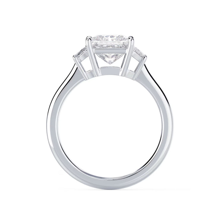 Side profile of princess cut lab grown diamond three stone engagement ring highlighting elegant prong setting