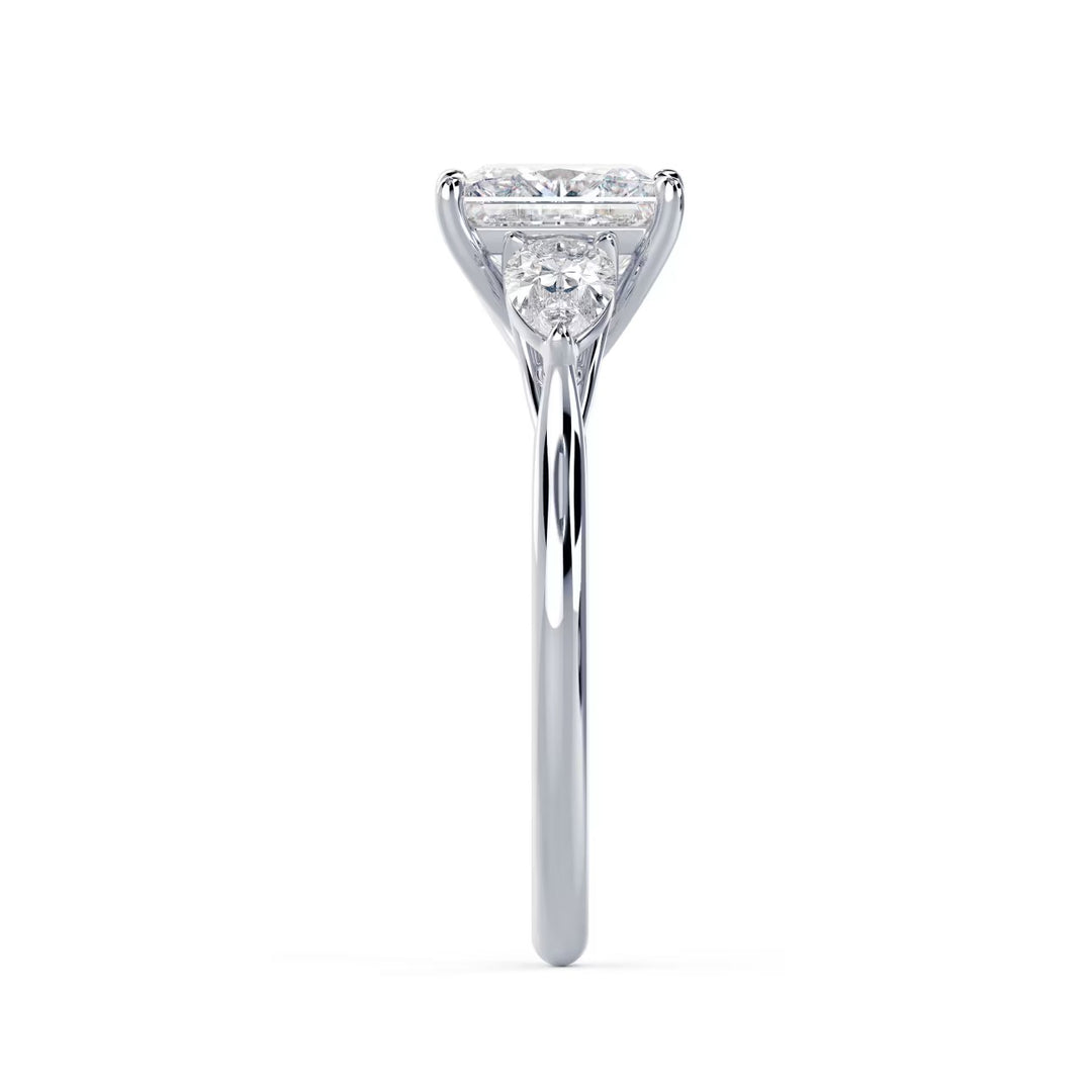 Close-up sparkle of princess cut lab grown diamond three stone engagement ring with E VS2 clarity and sharp brilliance