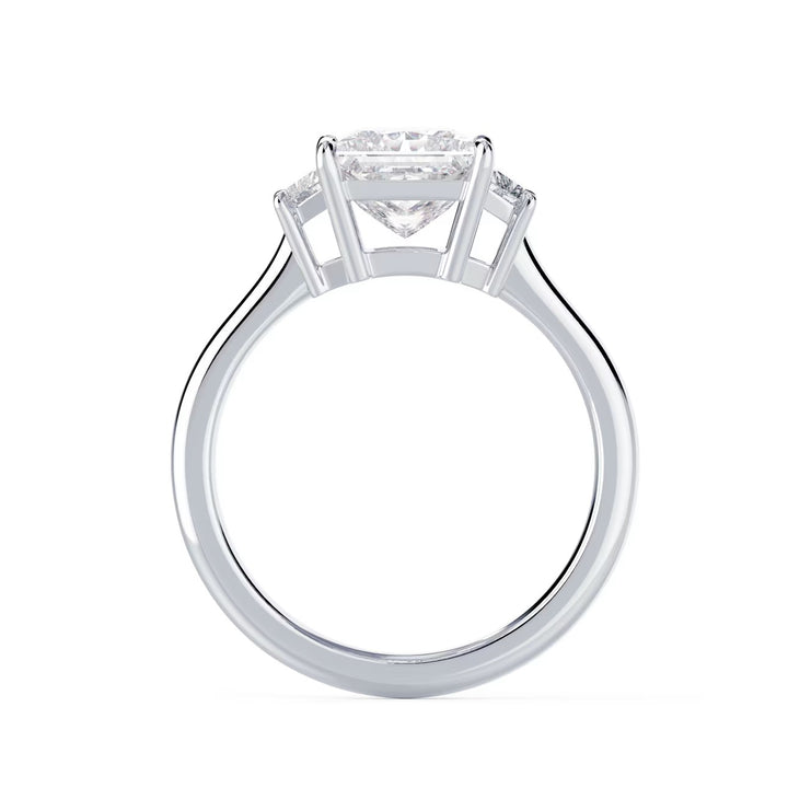 Close-up sparkle of princess cut lab grown diamond three stone engagement ring with E VS2 clarity and sharp brilliance