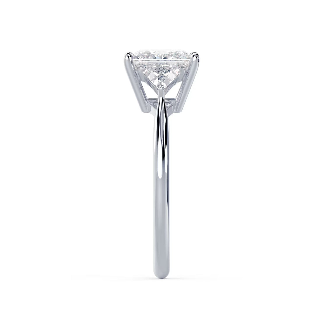 Close-up sparkle of princess cut lab grown diamond three stone engagement ring with E VS1 clarity and sharp brilliance
