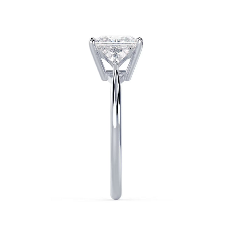 Close-up sparkle of princess cut lab grown diamond three stone engagement ring with E VS1 clarity and sharp brilliance