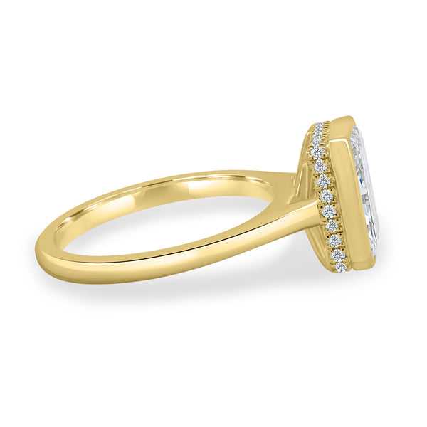 Side profile of bezel set radiant lab diamond engagement ring highlighting hidden halo detail and elevated center stone