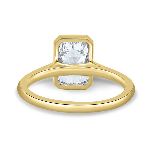 Side profile of bezel set radiant lab grown diamond engagement ring showing cathedral arches and elevated center stone