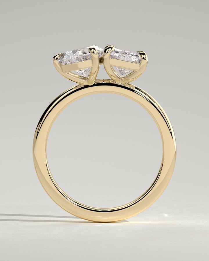Radiant cut and pear diamond ring