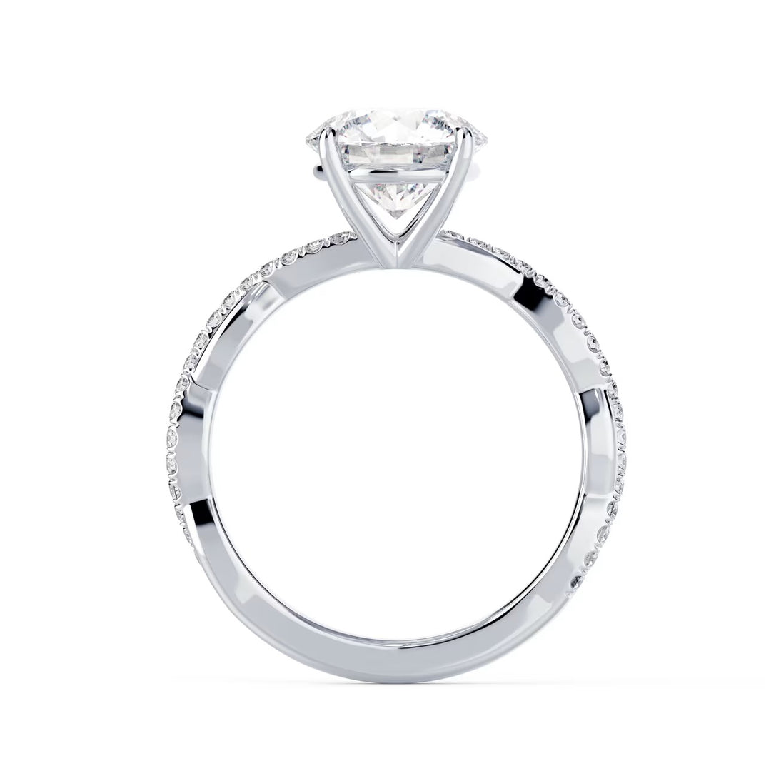 Close-up of a round cut lab grown diamond infinity pave engagement ring highlighting flowing infinity-inspired band design