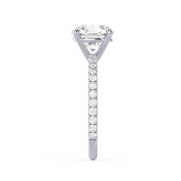 Close-up of a round cut lab grown diamond pave engagement ring highlighting brilliant fire and pavé band sparkle