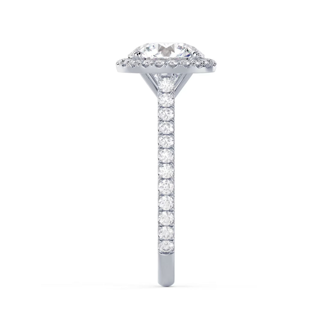 Side profile of a round cut lab grown diamond halo cathedral pave engagement ring showing raised cathedral structure