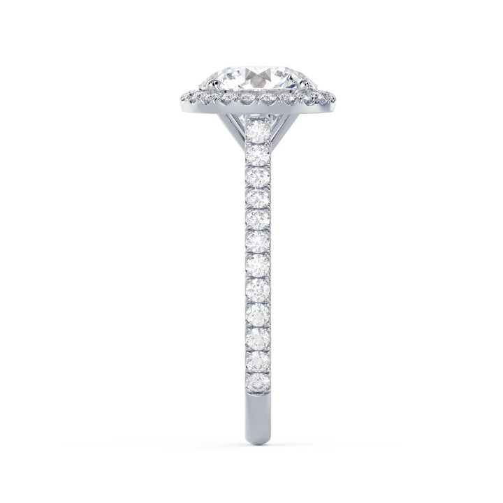Side profile of a round cut lab grown diamond halo cathedral pave engagement ring showing raised cathedral structure