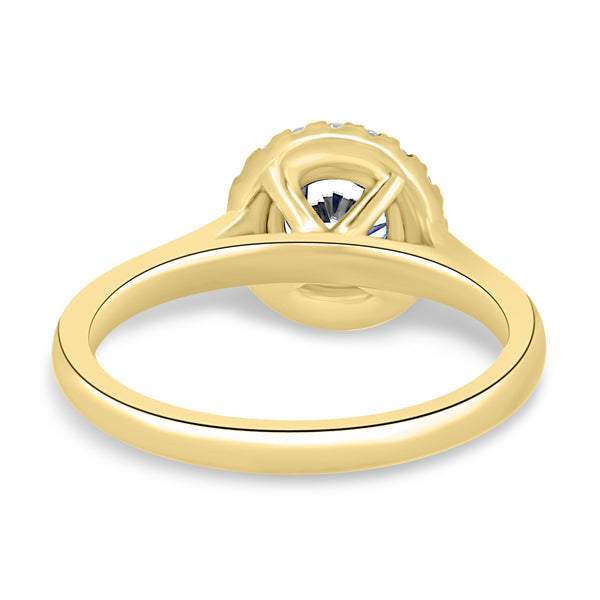 Close-up of round cut lab grown diamond halo solitaire engagement ring highlighting the halo setting and brilliant center stone