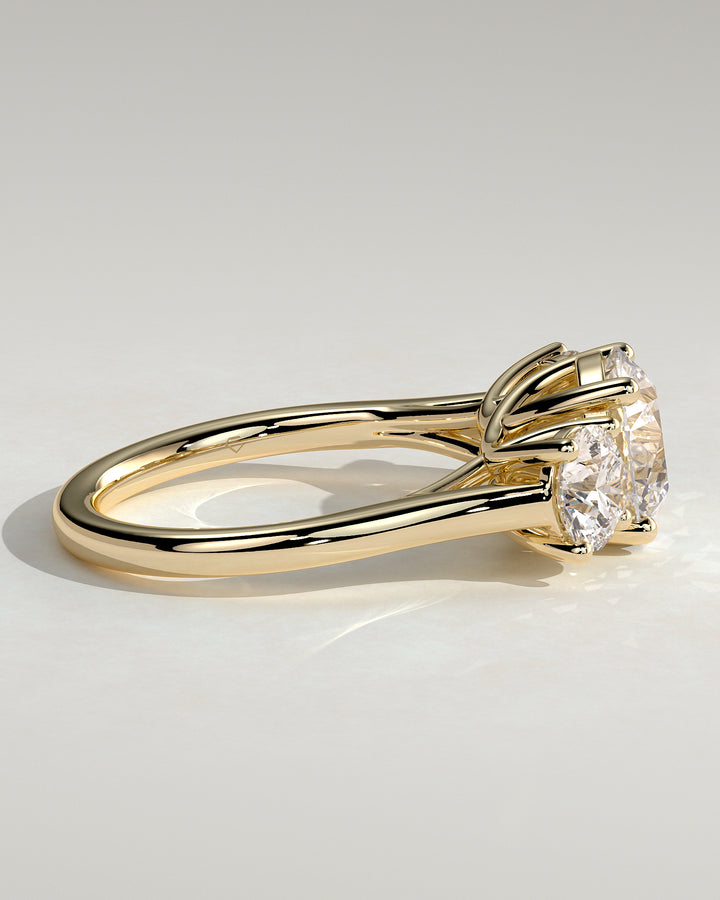 Round cut three stone ring