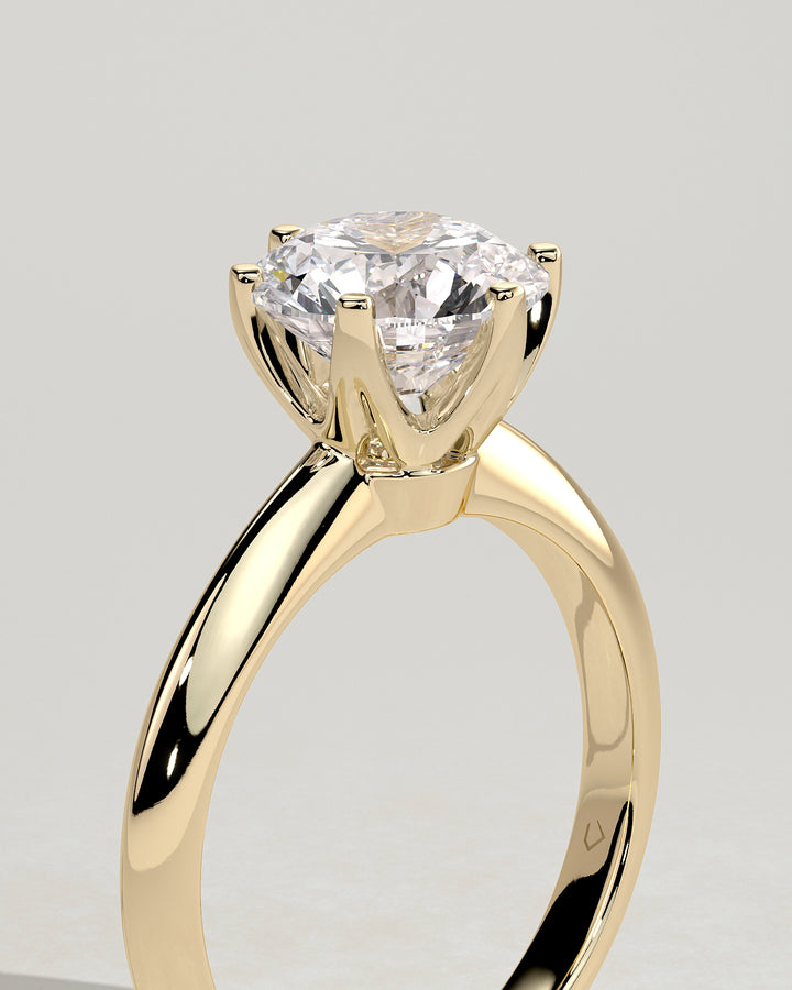 Round solitaire engagement ring