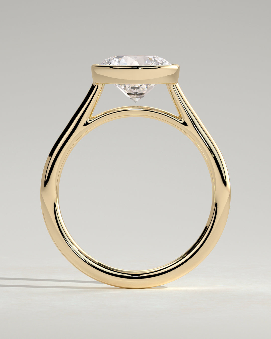 Sleek round bezel engagement ring