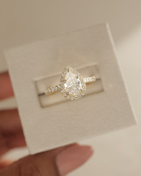 Sophisticated pear lab grown diamond halo cathedral pavé engagement ring with balanced proportions and elegant detailing