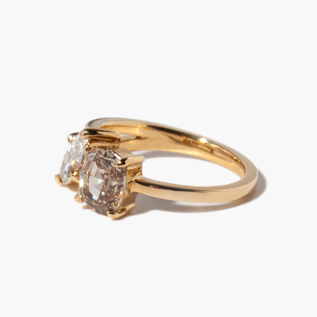 Detailed view of step cut and marquise CVD lab grown diamond engagement ring highlighting crisp geometry and vintage styling