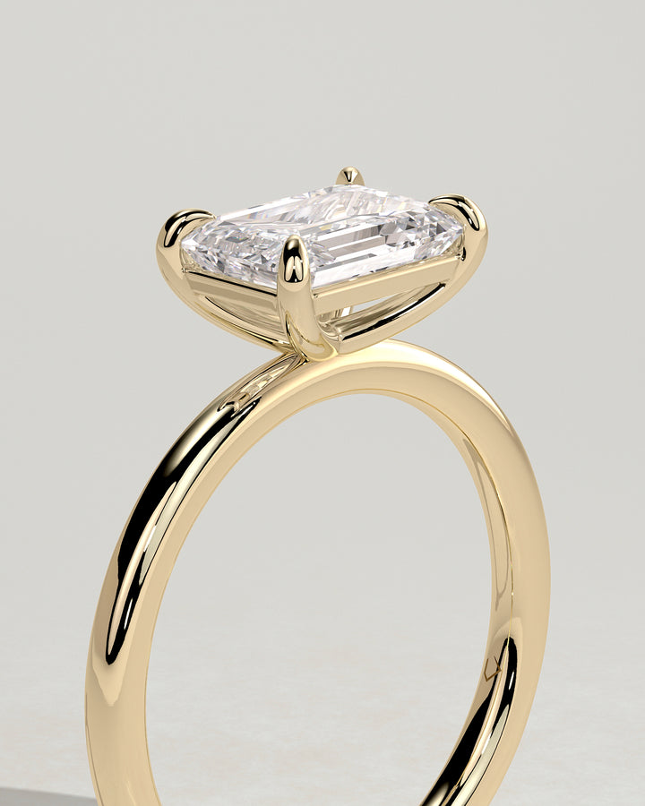 Step cut diamond engagement ring