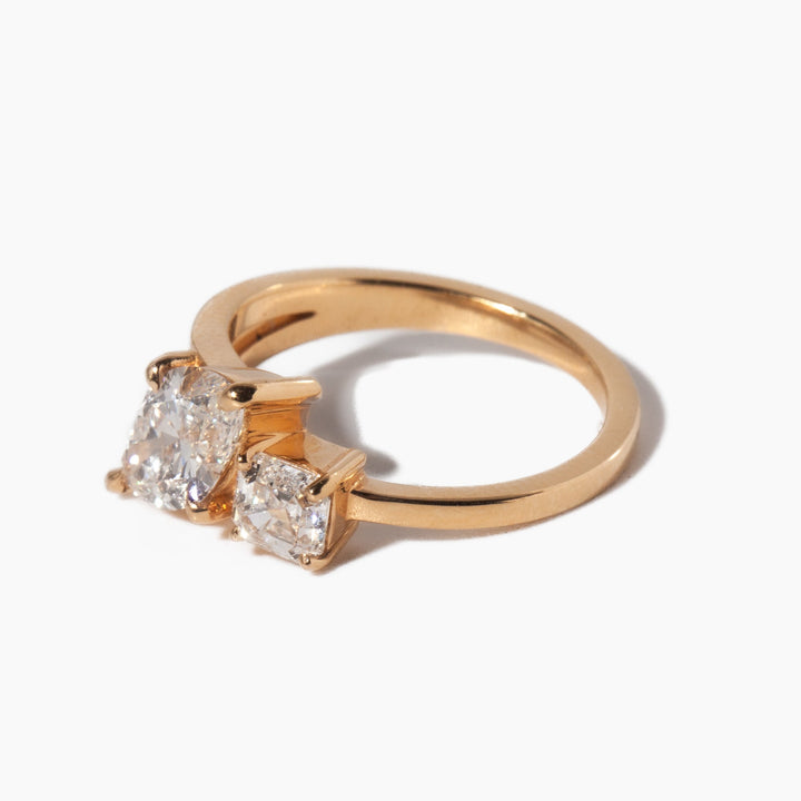 Side profile of marquise and Asscher cut lab grown diamond Toi Et Moi engagement ring with elegant dual stone structure