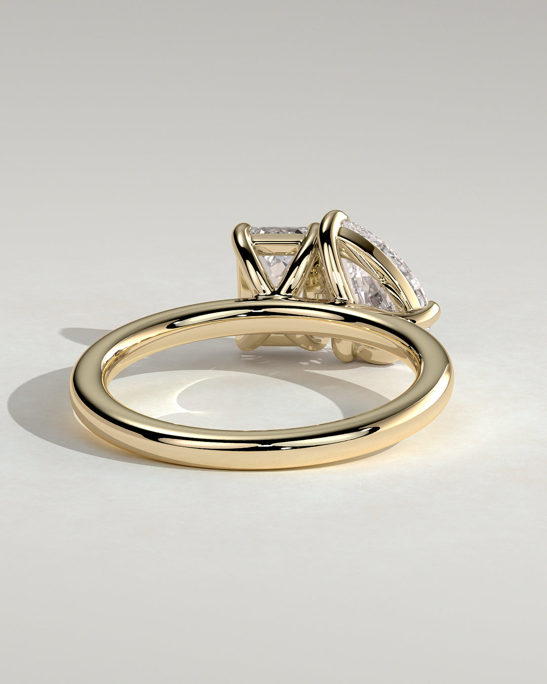 Two stone emerald and pear diamond
