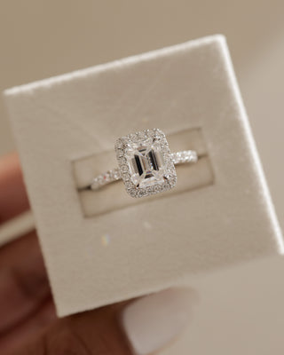 Emerald cut lab diamond halo pavé engagement ring inspired by popular USA bridal jewelry trends and styles
