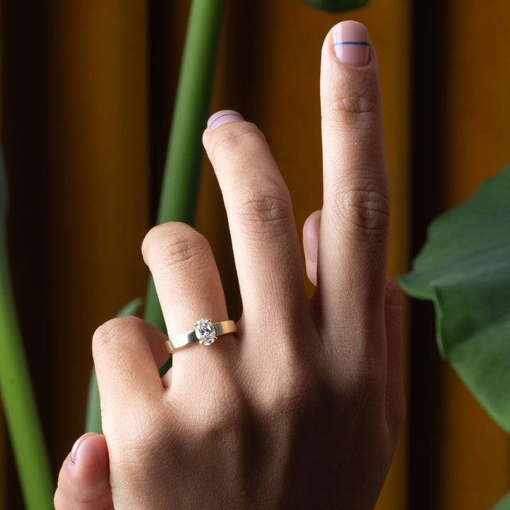 Oval lab grown diamond solitaire engagement ring designed for USA bridal trends focusing on simplicity and elegance