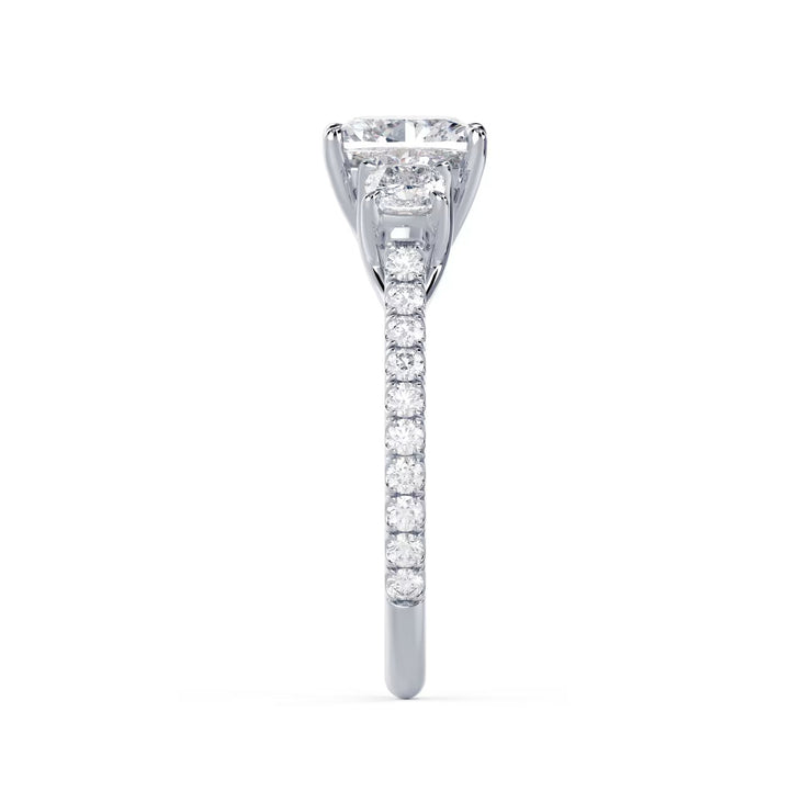 cushion cut three stone pavé engagement ring with side stones