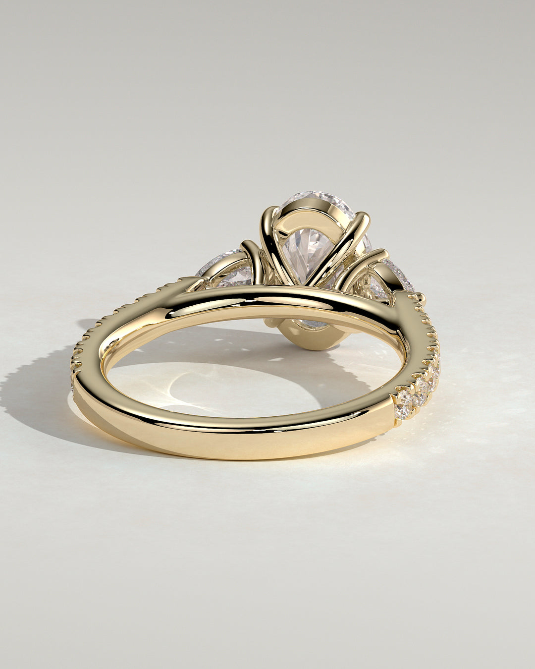 elongated pear-shaped side stone ring

