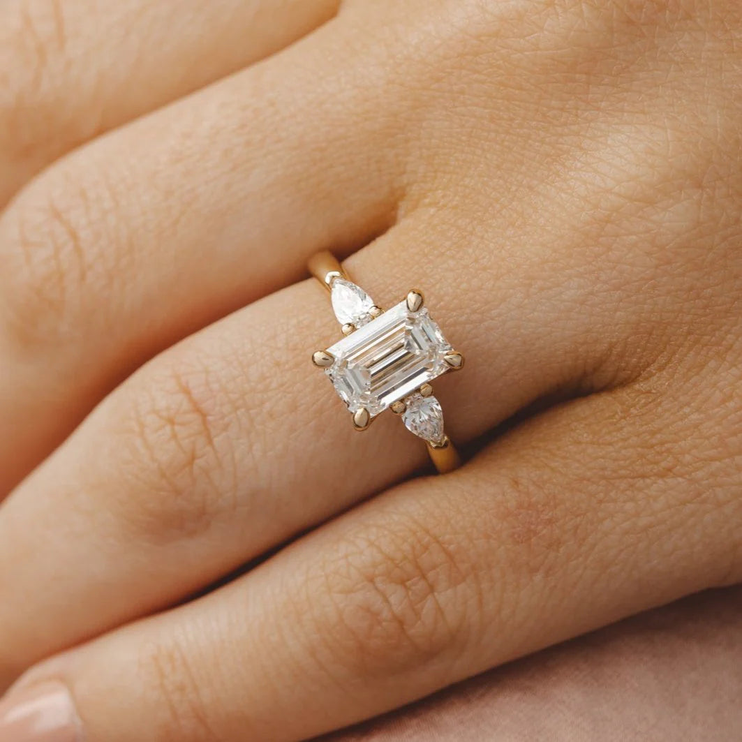 emerald three stone ring
