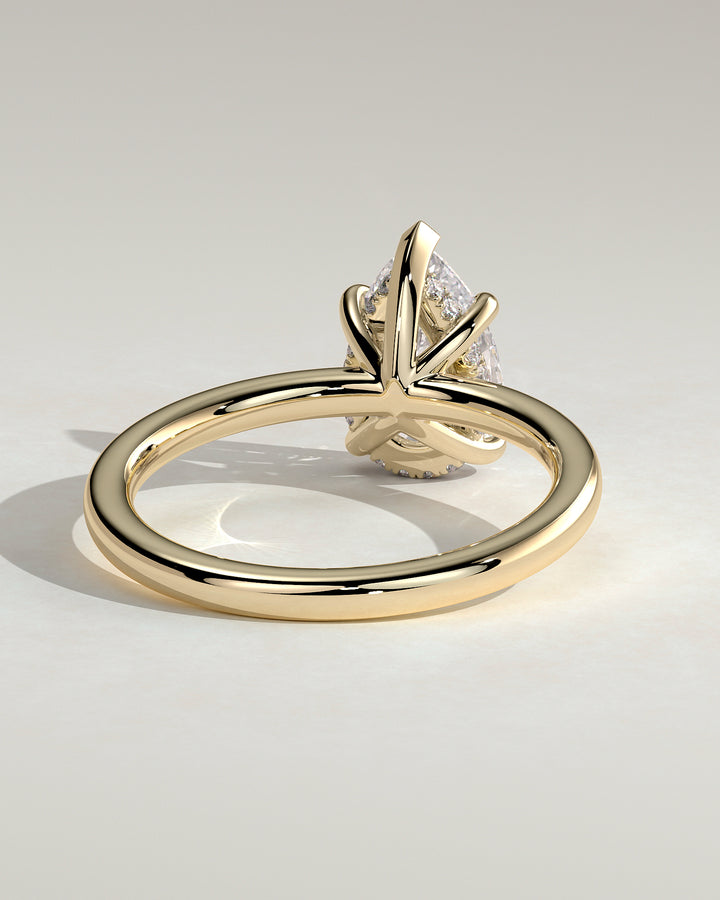engagement ring pear hidden halo