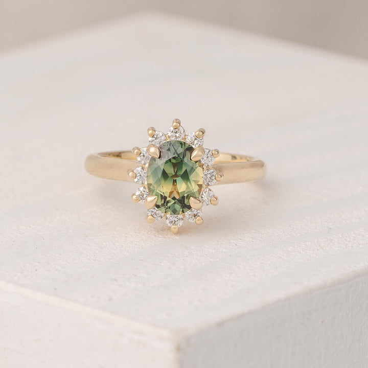 green oval halo ring
