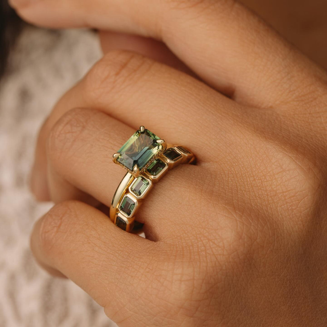 east west ring emerald 
