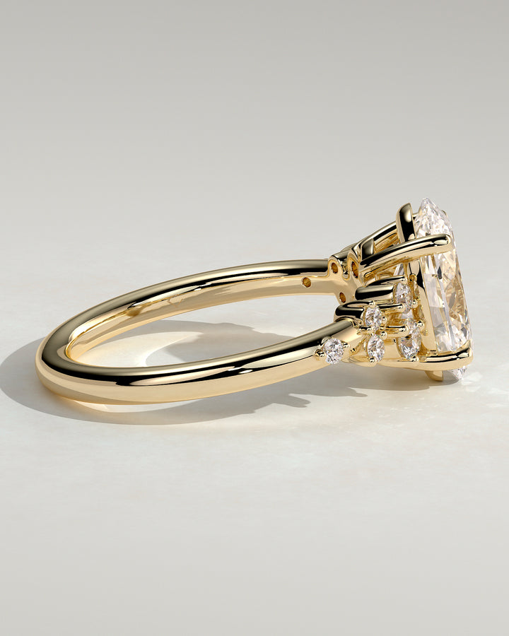 modern oval cluster engagement ring