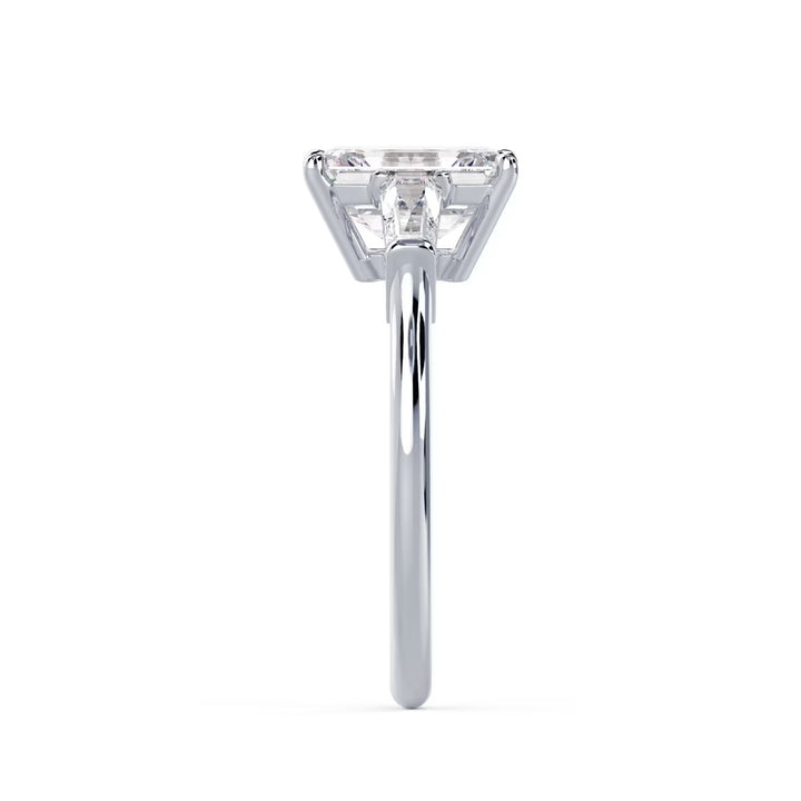 emerald cut three stone engagement ring with side stones E VS2