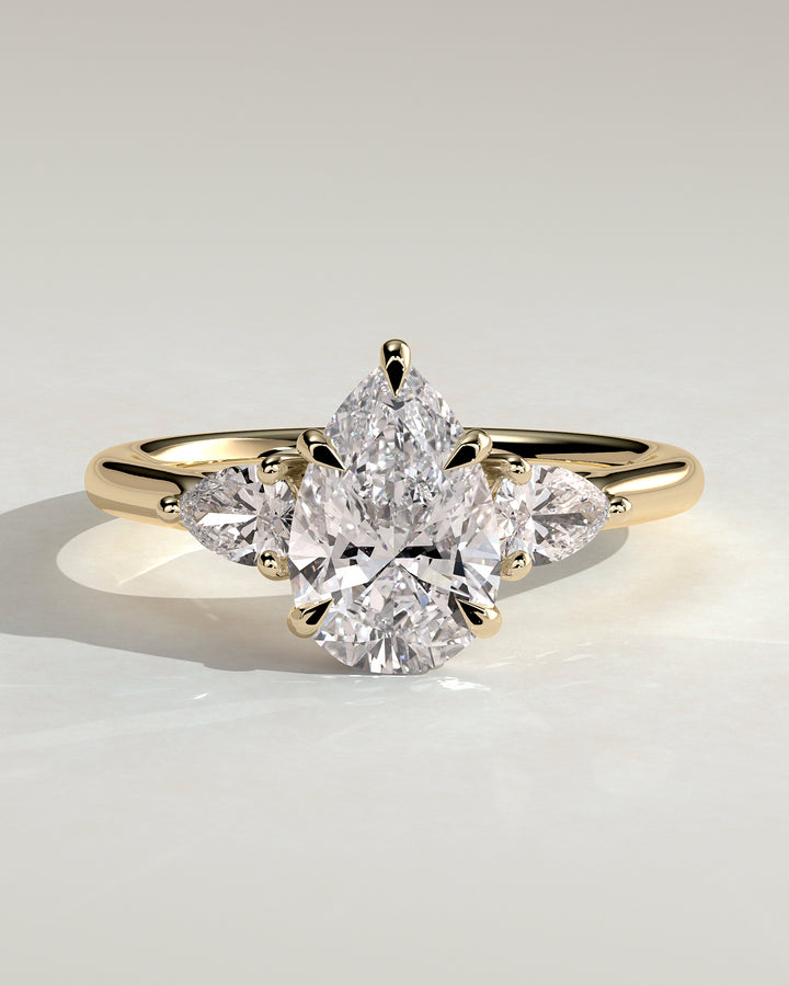 pear 3 stone engagement ring