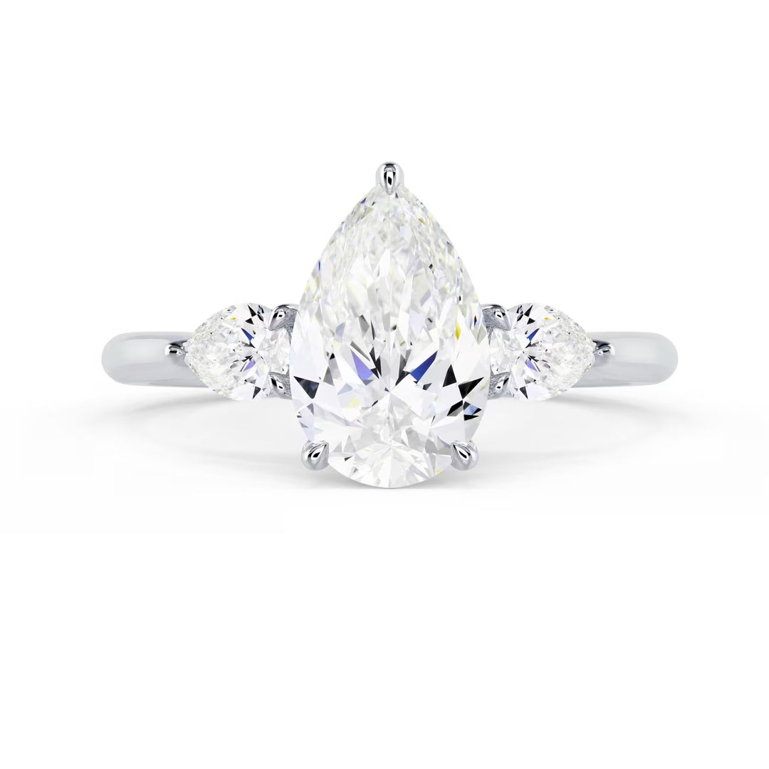 1.5 carat pear cut lab grown diamond three stone engagement ring E VS2