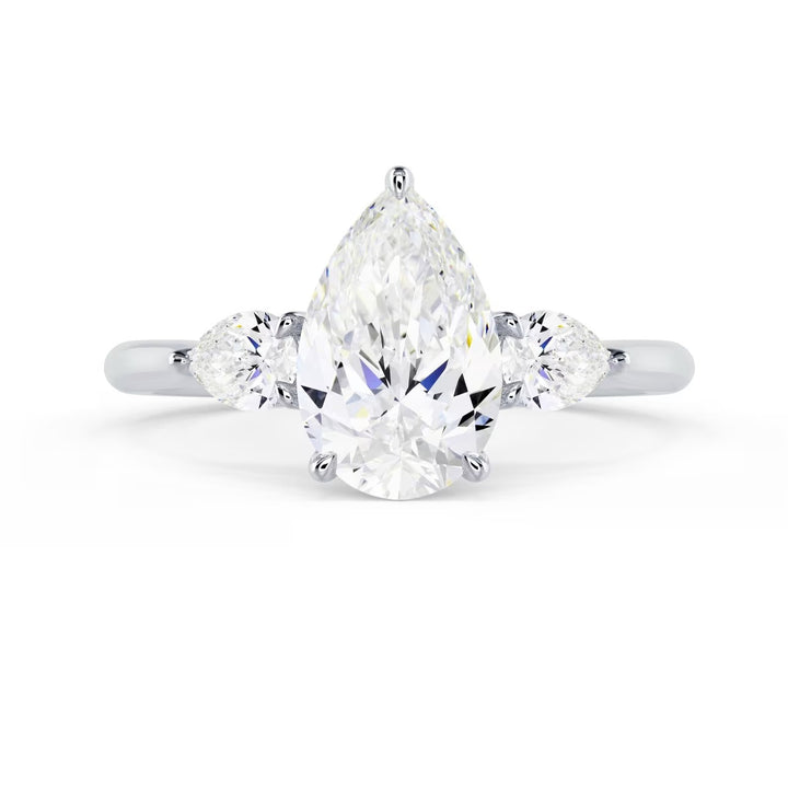 1.5 carat pear cut lab grown diamond three stone engagement ring E VS2