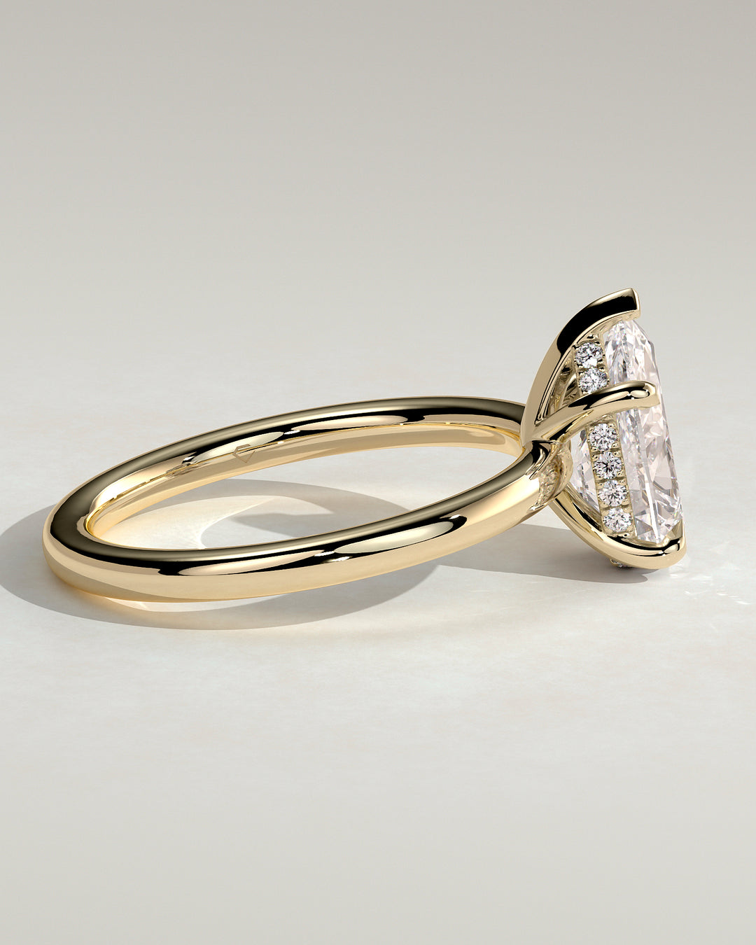 pear shaped hidden halo engagement ring