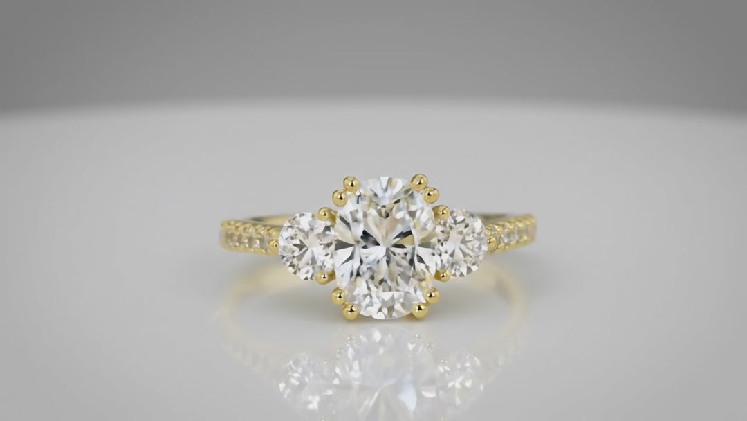 cushion cut three stone engagement ring
