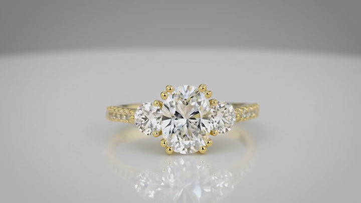 cushion cut three stone engagement ring

