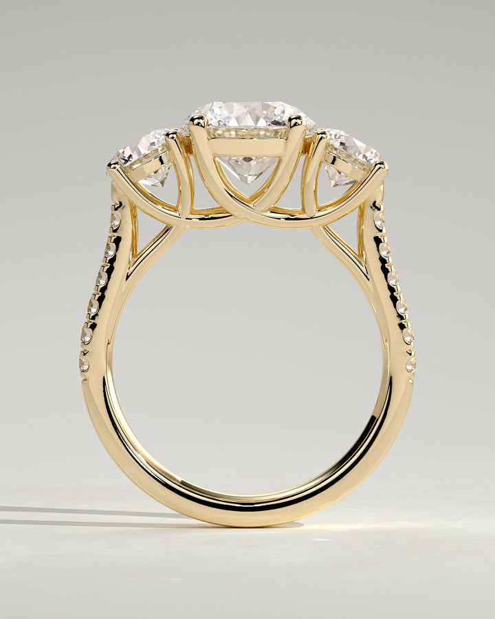 modern round three stone engagement ring