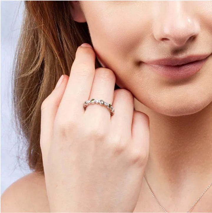 green cushion pear ring with wedding band 
